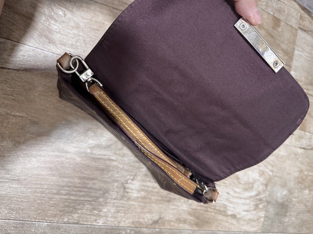 Louis Vuitton Monogram Canvas Shoulder Bag (Category: Luxury Bags & Wallets) located in Pasig City. Submitted by sdpii (Listing ID 1464770491, Image 2). Description: - Louis Vuitton monogram canvas flap bag in dark brown - Chic silver-tone hardware with a secure metal clasp closure - Spacious brown textile interior lining complete with brand patch label - Includes a versatile, detachable thin leather strap with stylish contrast yellow stitching -