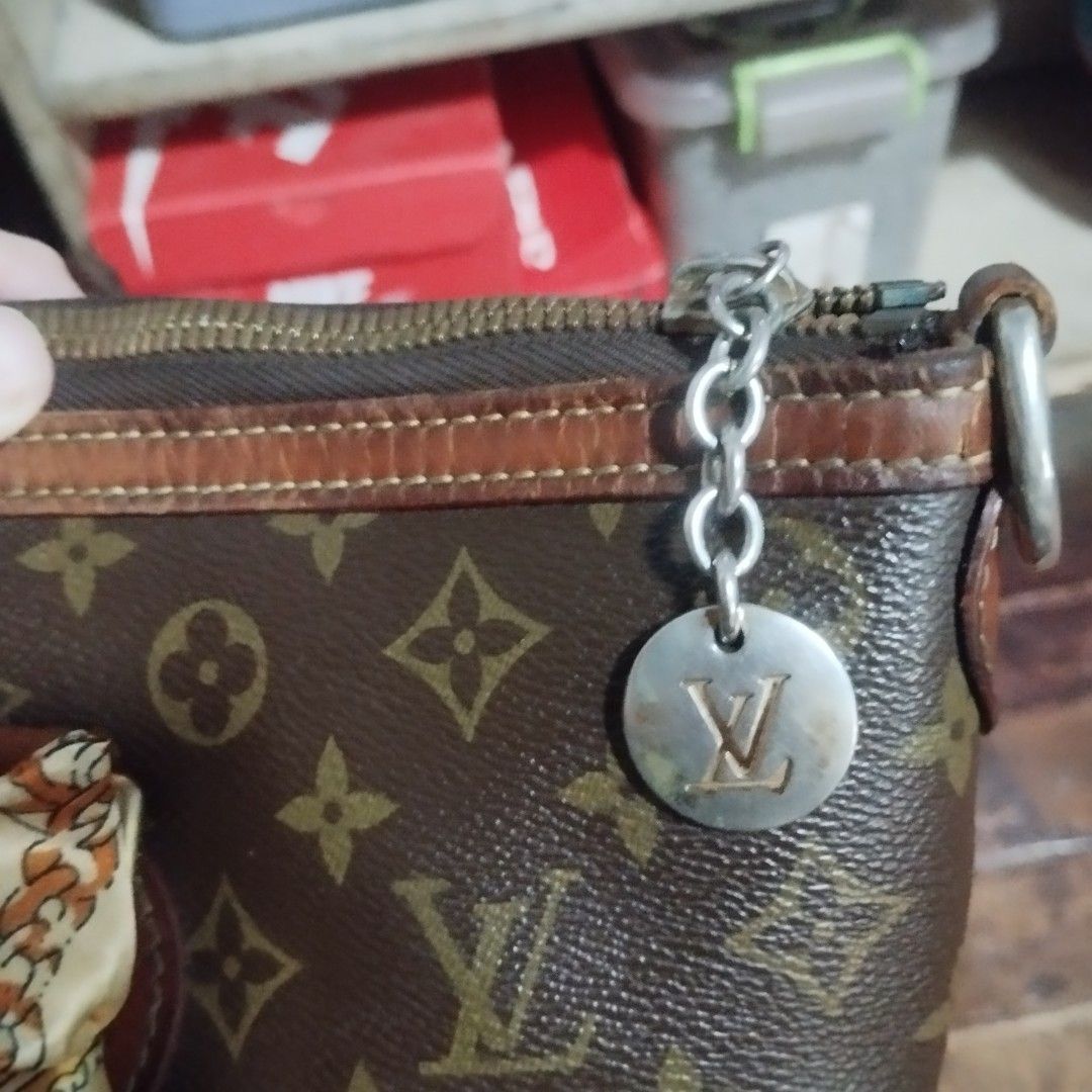 Louis Vuitton Monogram Canvas Tote Bag (Category: Tote Bags) located in Manila. Submitted by lene48 (Listing ID 1464774149, Image 3). Description: - monogram canvas pattern with chic brown leather trim - Secure zip top closure with a stylish metallic LV charm - Features trendy gathered front detailing and structured piping - Includes a cute twilly scarf wrapped around one handle.