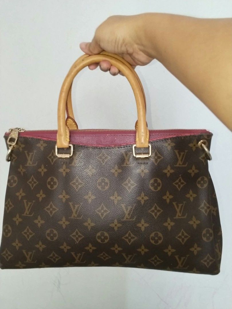 Louis Vuitton Monogram Canvas Handbag (Category: Tote Bags) located in Manila. Submitted by bagelyascollection (Listing ID 1464878196, Image 1). Description: - Brand: Louis Vuitton - Material: Classic Monogram canvas with tan leather trim and gold-tone hardware - Style: Handbag with top handles and secure zipper closure - Interior: Purple fabric lining with stamped leather tag (Louis Vuitton Paris made in France) - Authentication: Date code SP003