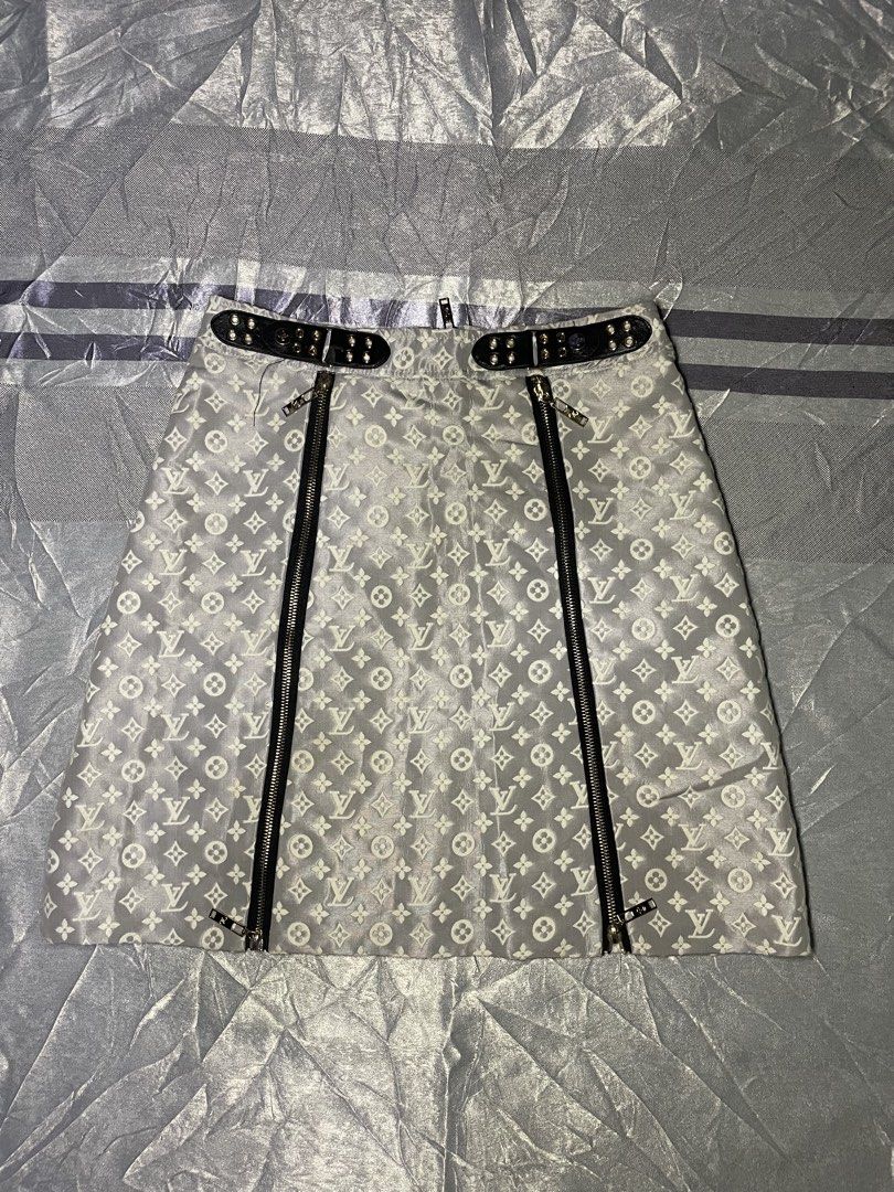 Louis Vuitton Monogram Jacquard Mini Skirt Grey White (Category: Skirts) located in San Fernando. Submitted by theglobalgoods (Listing ID 1464780695, Image 2). Description: - Authentic-style grey and white LV monogram pattern - Trendy double front zipper design with custom branded hardware - Black leather-look waist buckle accented with gold grommets and LV logo button - Fully lined with smooth white fabric for comfortable wear - Features the cla