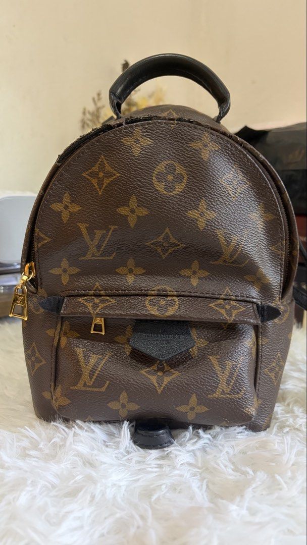 Louis Vuitton Monogram Palm Springs Mini Backpack (Category: Luxury Bags & Wallets) located in Dumaguete. Submitted by freshcornerbyyeng (Listing ID 1464783581, Image 1). Description: - Authentic Louis Vuitton monogram canvas mini backpack - Dark brown leather top handle and adjustable shoulder straps - Classic gold-tone hardware throughout - Front zipper pocket with black leather pull detail - Secure interior main compartment with dual zip closu