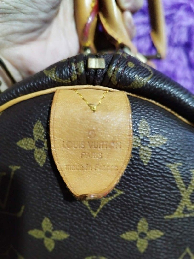 Louis Vuitton Monogram Speedy 25 Handbag (Category: Luxury Bags & Wallets) located in Quezon City. Submitted by cloudymay (Listing ID 1464795987, Image 3). Description: - Classic Louis Vuitton monogram canvas barrel silhouette - Secure zip top closure with interior zip pull - Double rolled leather top handles for comfortable wear - Tan leather trim accented with signature contrast yellow stitching - Elegant gold-tone hardware throughout - Feature