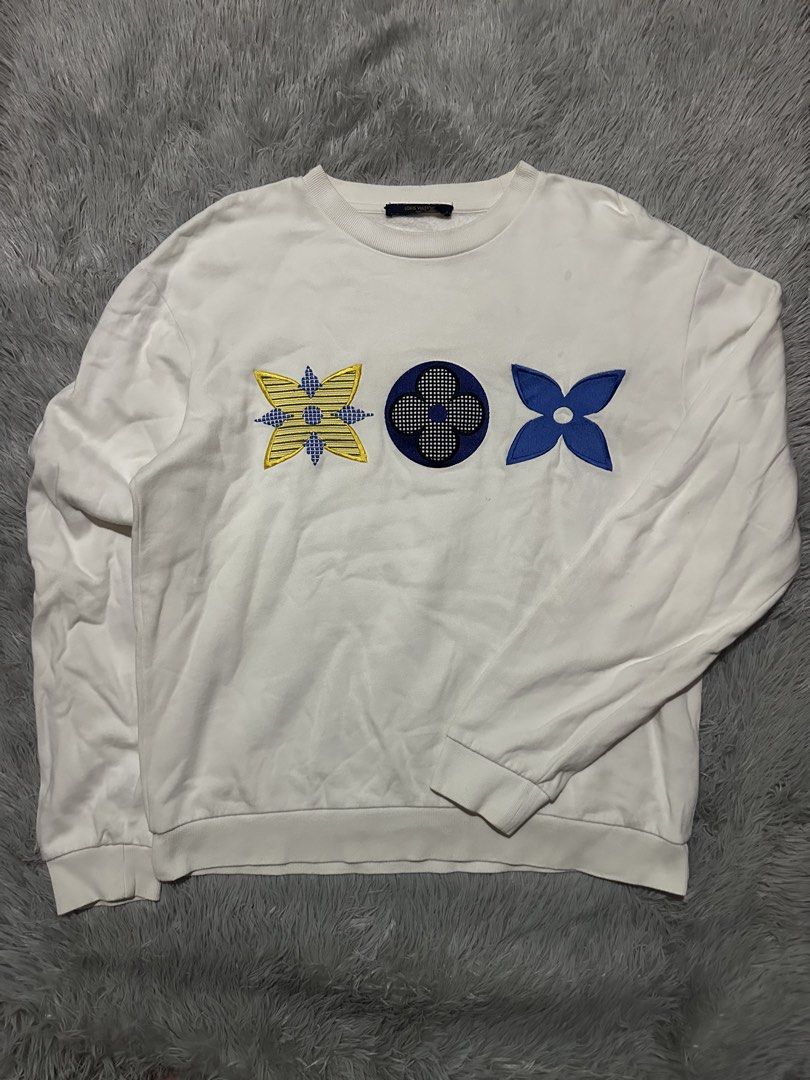Louis Vuitton Monogram White Sweatshirt Size S (Category: Luxury Apparel) located in Malabon City. Submitted by denzhamor (Listing ID 1464806797, Image 1). Description: - Brand: Louis Vuitton - Item: Crewneck Sweatshirt - Color: White with yellow and blue embroidered monogram motifs - Size: 23x27 - Origin: Made in Italy - Details: Ribbed collar, cuffs, and hem - Style Code: RM202M FMC HJY22W.