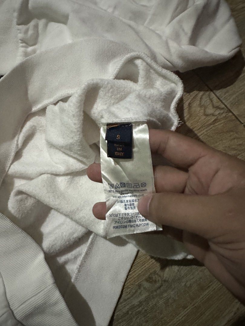Louis Vuitton Monogram White Sweatshirt Size S (Category: Luxury Apparel) located in Malabon City. Submitted by denzhamor (Listing ID 1464806797, Image 3). Description: - Brand: Louis Vuitton - Item: Crewneck Sweatshirt - Color: White with yellow and blue embroidered monogram motifs - Size: 23x27 - Origin: Made in Italy - Details: Ribbed collar, cuffs, and hem - Style Code: RM202M FMC HJY22W.