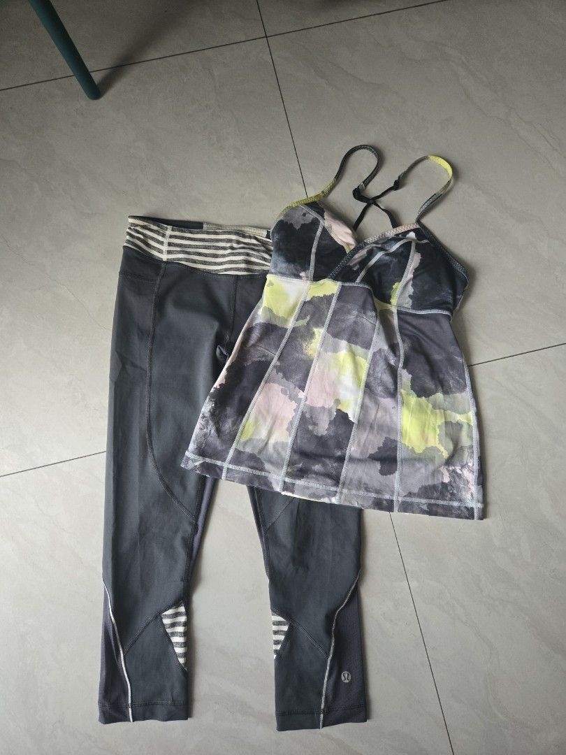 Lululemon Activewear Set Top and Leggings (Category: Activewear) located in Pasig City. Submitted by izzy0202 (Listing ID 1464825164, Image 1). Description: Lululemon workout set. Tank top features abstract watercolor pattern in grey, yellow, and white with adjustable straps and built-in bra. Matching dark grey leggings have mesh panels and striped contrast cuffs at the ankles. Iconic Lululemon omega logo printed on the leg. Great outfit for gym 