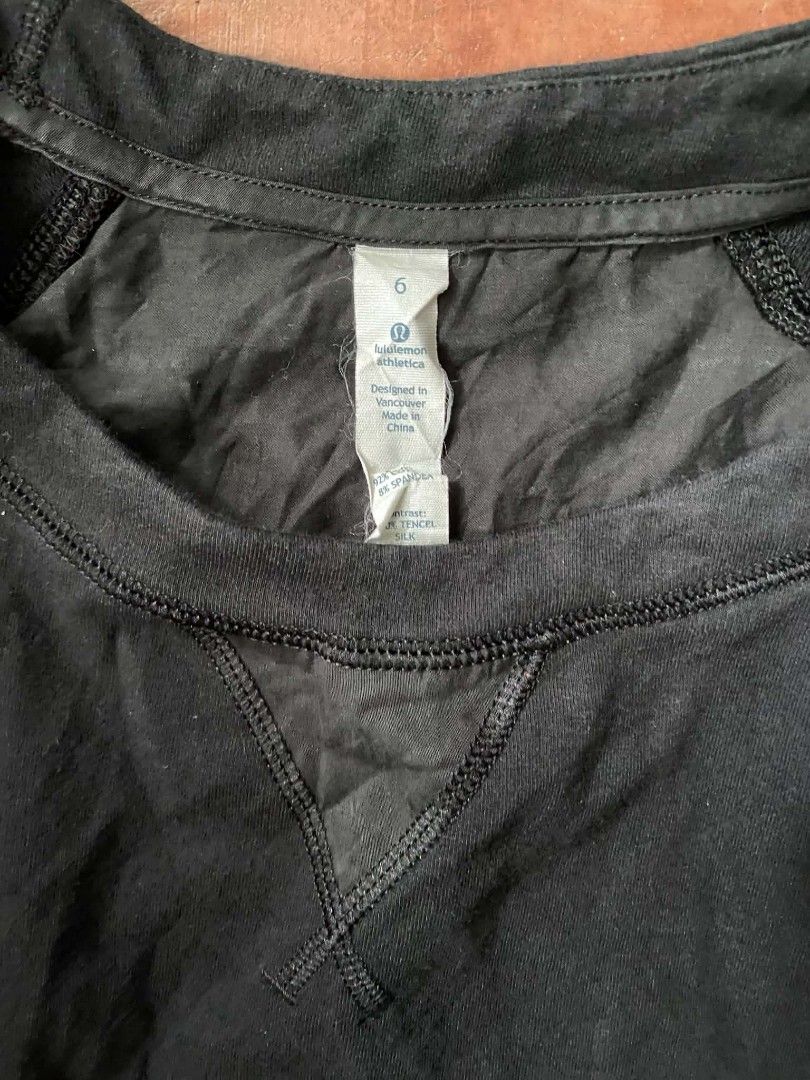 Lululemon Athletica Black Sweatshirt Size 6 (Category: Coats, Jackets and Outerwear) located in Gumaca. Submitted by makuliti (Listing ID 1464821845, Image 2). Description: - Brand: Lululemon - Color: Classic Black - Size: 6 (tag attached) - Style: Long sleeve crewneck pullover with front V-stitch detail - Details: Contrast panels at back yoke and shoulders, ribbed cuffs and hem - Safety/Design: Small reflective logo on lower left back hem - Mate