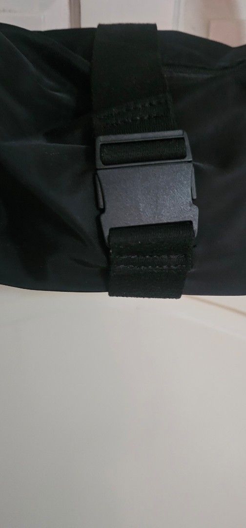 Lululemon Black Crossbody Bag (Category: Cross-body Bags) located in Davao. Submitted by sachigo (Listing ID 1464807006, Image 3). Description: - Brand: Lululemon - Color: Classic Black with white logo - Material: Durable, water-resistant nylon - Closure: Secure front buckle strap - Pockets: Exterior zip pocket and multiple interior compartments - Strap: Adjustable for custom comfort - Use: Ideal for gym sessions, travel, and daily errands - Cond