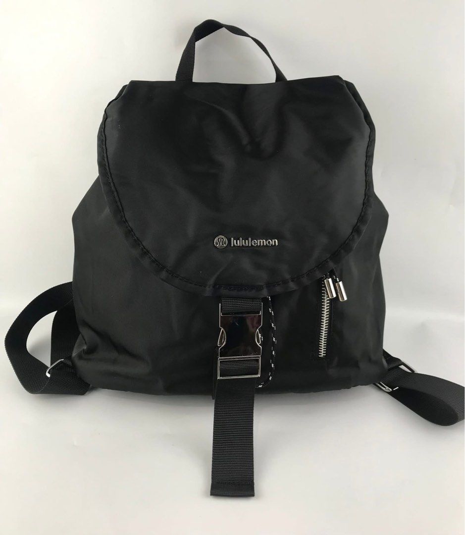 Lululemon Nylon Backpack Bag (Category: Backpacks) located in Bacoor. Submitted by faith.hope.love28 (Listing ID 1464830497, Image 1). Description: - Brand new with tag still attached - Material: 100% nylon body with recycled polyester lining - Closure: Secure buckle and drawstring main compartment - Pockets: Front flap side zip pocket, interior zippered pocket, and slip pocket - Comfort & Carry: Adjustable shoulder straps and top grab handle - C