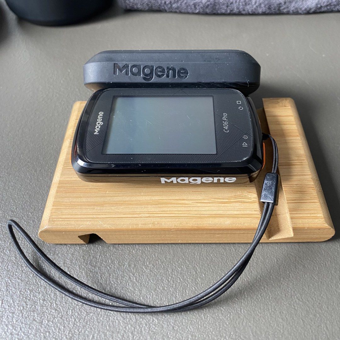 Magene C406 Pro GPS bike computer with silicone case (Category: Bicycles) located in Cavite. Submitted by clarenceaeron (Listing ID 1464811934, Image 3). Description: - Model: Magene C406 Pro GPS cycling computer (Black) - Condition: Screen has light scratches on screen protector from regular use, powers on and functions normally - Included Accessories: Black protective silicone case and wrist lanyard - Design: Distinctive orange power button on 
