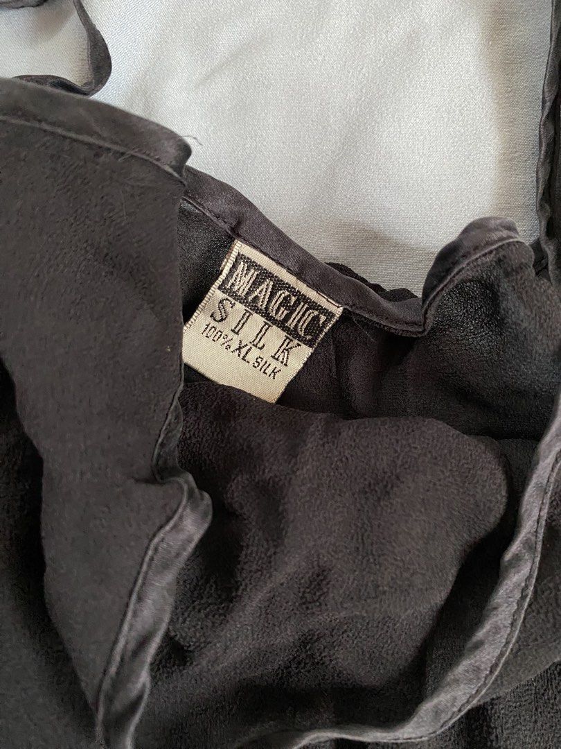 Magic Silk 100% Silk Black Slip Dress (Category: Dresses) located in Manila. Submitted by heyheyruok (Listing ID 1464798457, Image 2). Description: - Brand: Magic Silk - Material: 100% Pure Silk (Super soft & lightweight) - Color: Classic Black - Size: XL - Design: V-neckline with thin adjustable straps & flowy mini length - Versatile: Great for sleeping, lounging, or chic layering.