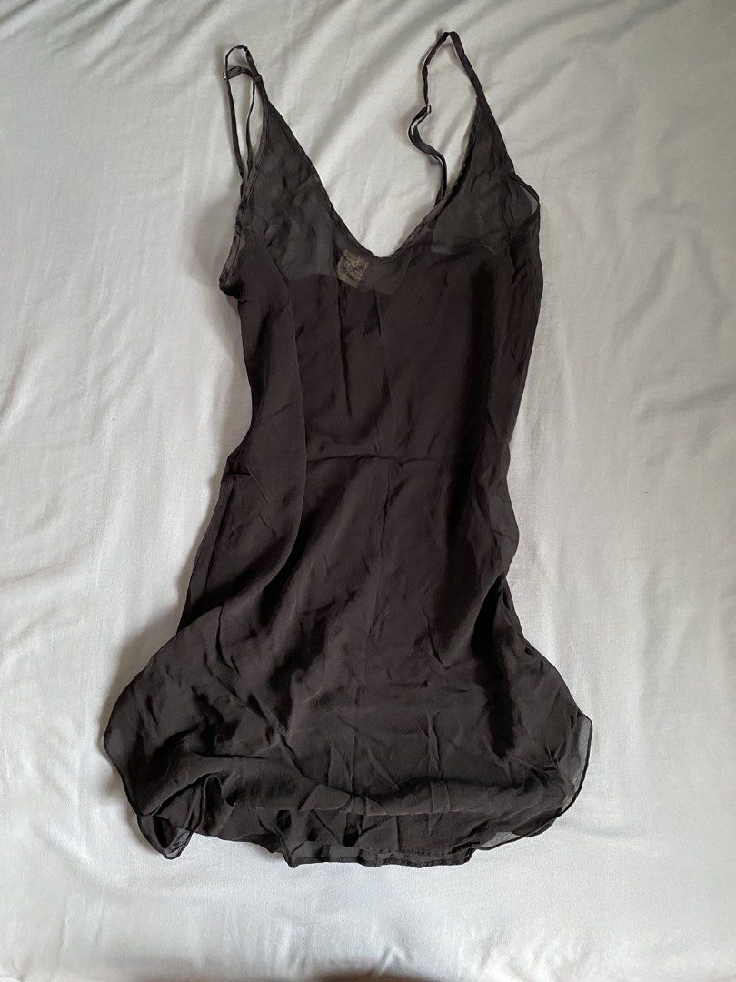 Magic Silk 100% Silk Black Slip Dress (Category: Dresses) located in Manila. Submitted by heyheyruok (Listing ID 1464798457, Image 1). Description: - Brand: Magic Silk - Material: 100% Pure Silk (Super soft & lightweight) - Color: Classic Black - Size: XL - Design: V-neckline with thin adjustable straps & flowy mini length - Versatile: Great for sleeping, lounging, or chic layering.
