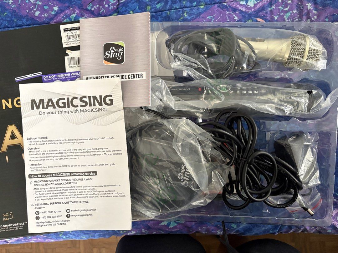 Magic Sing Karat Premium WiFi Karaoke System (Category: Entertainment Systems & Smart Home Devices) located in Quezon City. Submitted by jennybug (Listing ID 1464791381, Image 2). Description: - opened to test but never used - Complete Magic Sing Karat Premium karaoke system in original box - Includes 2 microphones, hub base, manual, standard cables, and power adapter - Built-in Wi-Fi with Full HD smart videoke support - Over 5,000 preloaded song