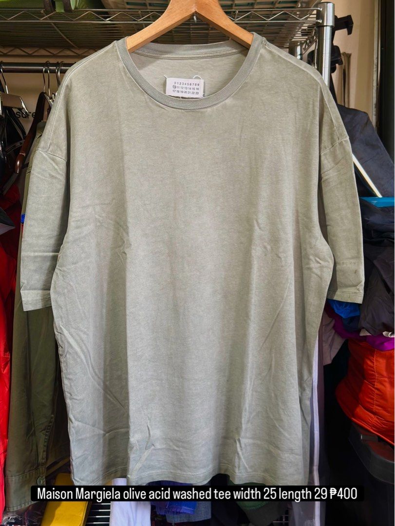 Maison Margiela Olive Acid Washed Tee Size 48 (Category: Shirts) located in Daet. Submitted by thrifthings2018 (Listing ID 1464840190, Image 1). Description: - Brand: Maison Margiela - Item: Olive Acid-Washed T-Shirt - Size: 48 (Made in Italy) - Details: Iconic numeric tag on the back collar - Condition: Pre-owned, with minor stains on the sleeve as pictured.