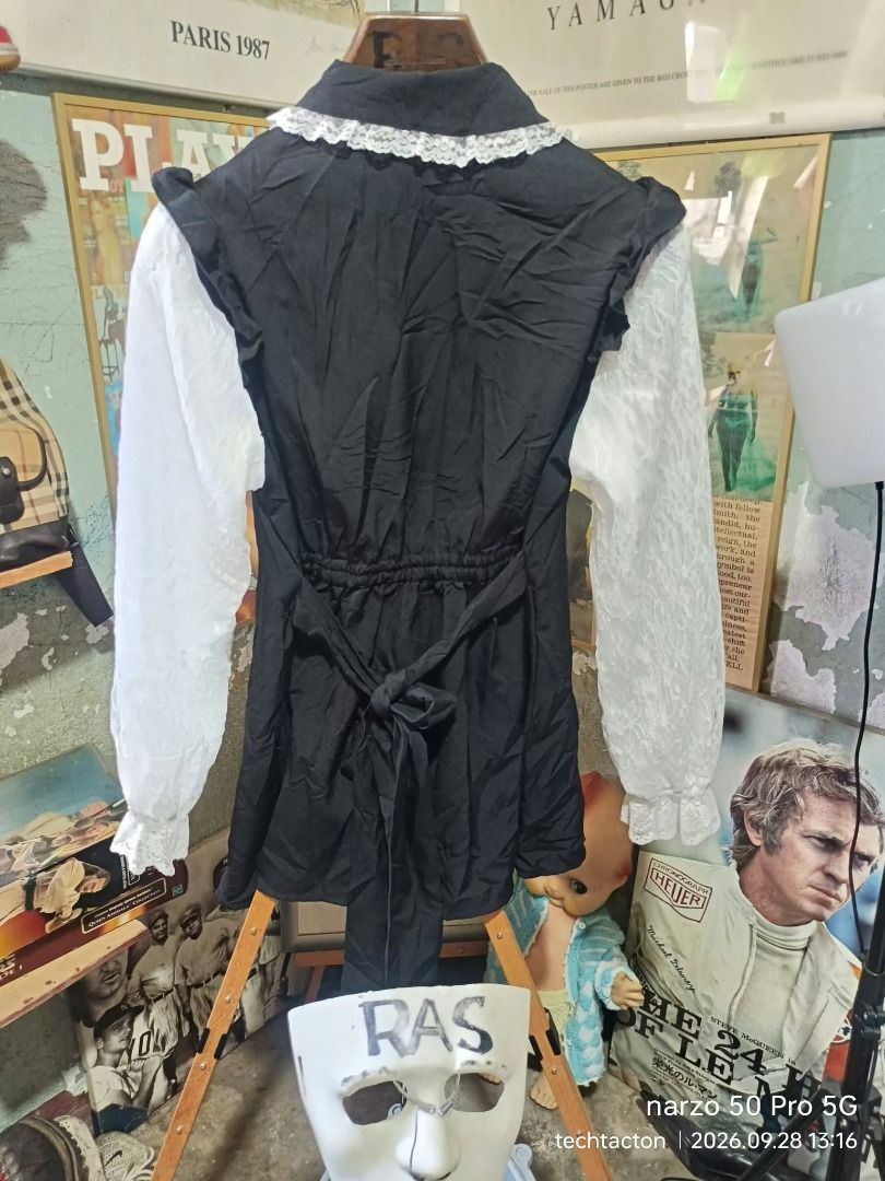 Majoretti Gothic LS (Category: Blouses) located in Santo Tomas. Submitted by pickers_corner (Listing ID 1464771461, Image 2). Description: Majoretti size L excellent condition no issue - Color & Style: Black body with sheer white long sleeves - Design Details: Big lace collar, matching lace bow tie, ruffled lace trim, and front button closure - Fit & Adjustability: Elastic waist at the back with a tie sash for a flattering fit - Size: L (fits bus