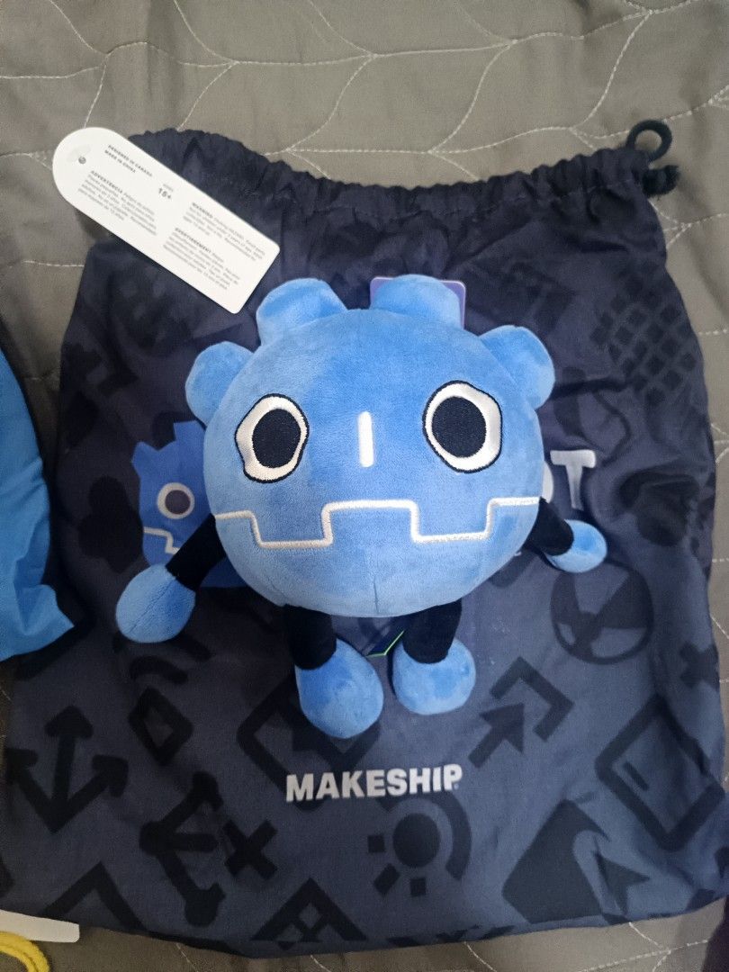 Makeship Blue Character Plush Toy with Drawstring Bag (Category: Plushies & Soft Toys) located in Rizal. Submitted by yearn2earn (Listing ID 1464948671, Image 1). Description: - Official Makeship blue plush toy - Features detailed stitched face and striped arms and legs - Comes with original branded dark grey drawstring dust bag - Original paper tag still attached - Carefully stored, clean fabric, and zero signs of wear.