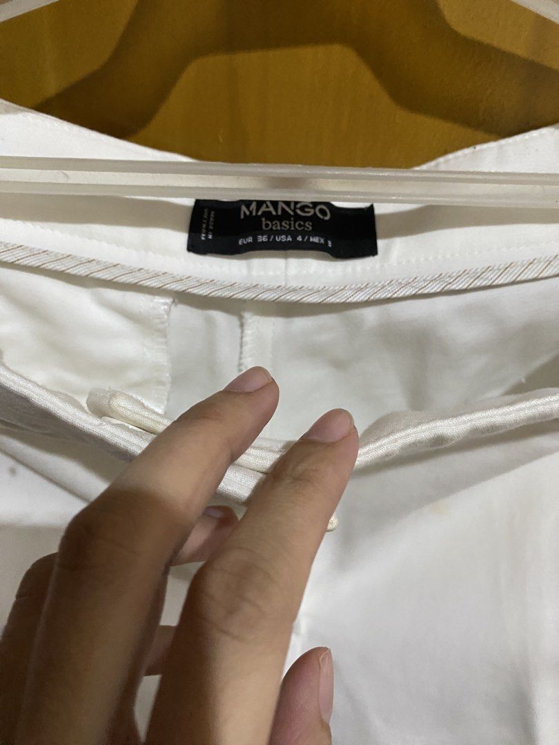 Mango Basics White Pants EUR 36 USA 4 (Category: Jeans) located in Antipolo. Submitted by jl_2025 (Listing ID 1464874293, Image 1). Description: - Brand: Mango Basics - Size: EUR 36 / USA 4 / MEX 3 - Color: Solid white - Material: 100% cotton - Fit: Straight-leg cut - Details: Standard waistband, zip fly, and button closure - Condition: Good shape, ready to wear - Style: Versatile neutral staple for casual or smart-casual outfits Issue: yellowing