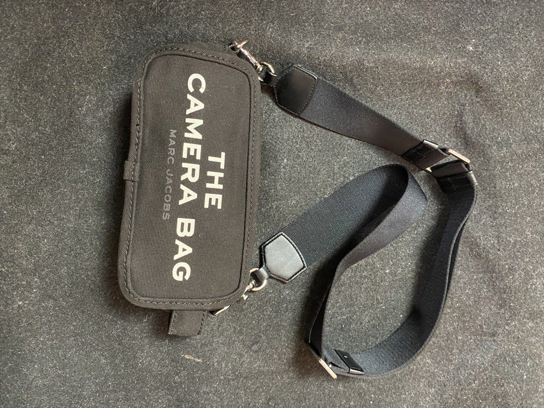 MARC JACOBS The Camera Bags (Category: Cross-body Bags) located in Quezon City. Submitted by loloyz123 (Listing ID 1464918012, Image 1). Description: MARC JACOBS The Camera Bags Condition: Very good Color rate: 10/10 Color: Black/ canvas Size: L: 11cm W: 23cm depth: 8.5cm.