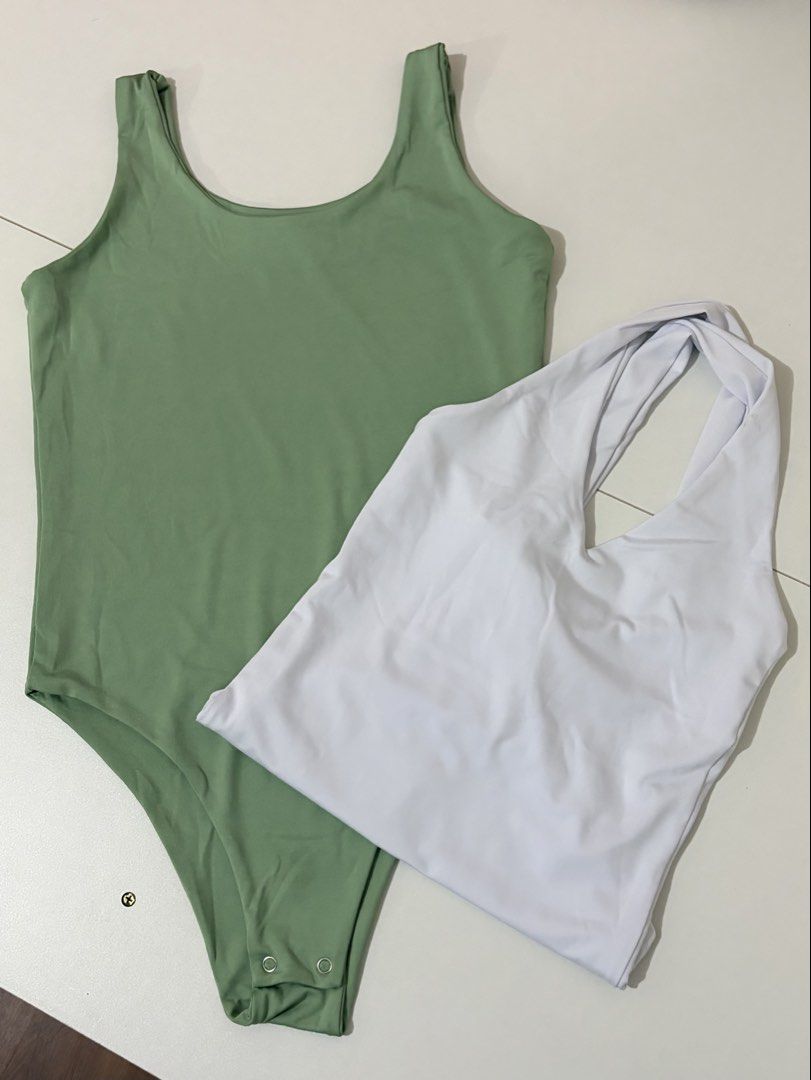 Maria & Mary Bodysuit Set Green White (Category: Sets or Coordinates) located in Cainta. Submitted by knarv__ (Listing ID 1464882442, Image 1). Description: Maria & Mary bodysuits in size M. Includes 1 sage green tank style with snap buttons and 1 white halter style with twisted straps. Both made of soft, stretchy, clean fabric. Perfect wardrobe basics for pairing with jeans or skirts..