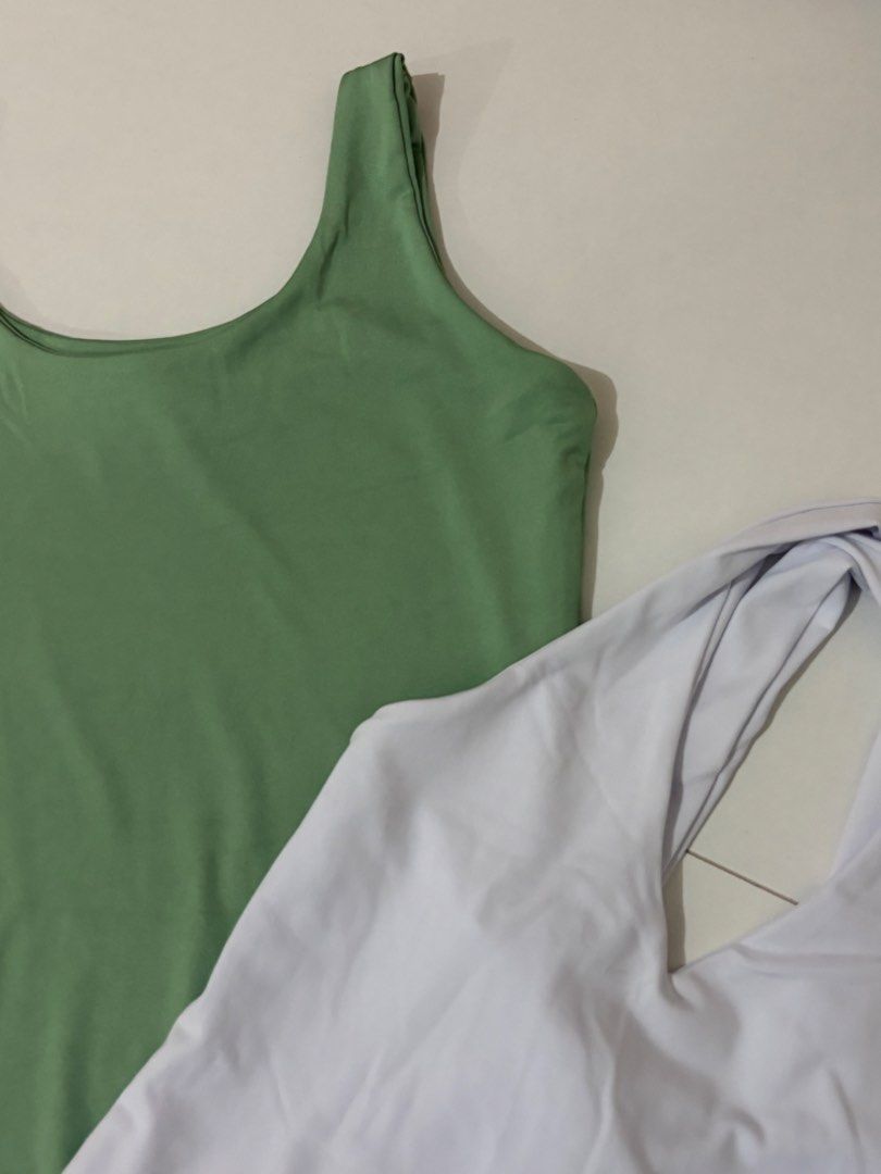 Maria & Mary Bodysuit Set Green White (Category: Sets or Coordinates) located in Cainta. Submitted by knarv__ (Listing ID 1464882442, Image 2). Description: Maria & Mary bodysuits in size M. Includes 1 sage green tank style with snap buttons and 1 white halter style with twisted straps. Both made of soft, stretchy, clean fabric. Perfect wardrobe basics for pairing with jeans or skirts..