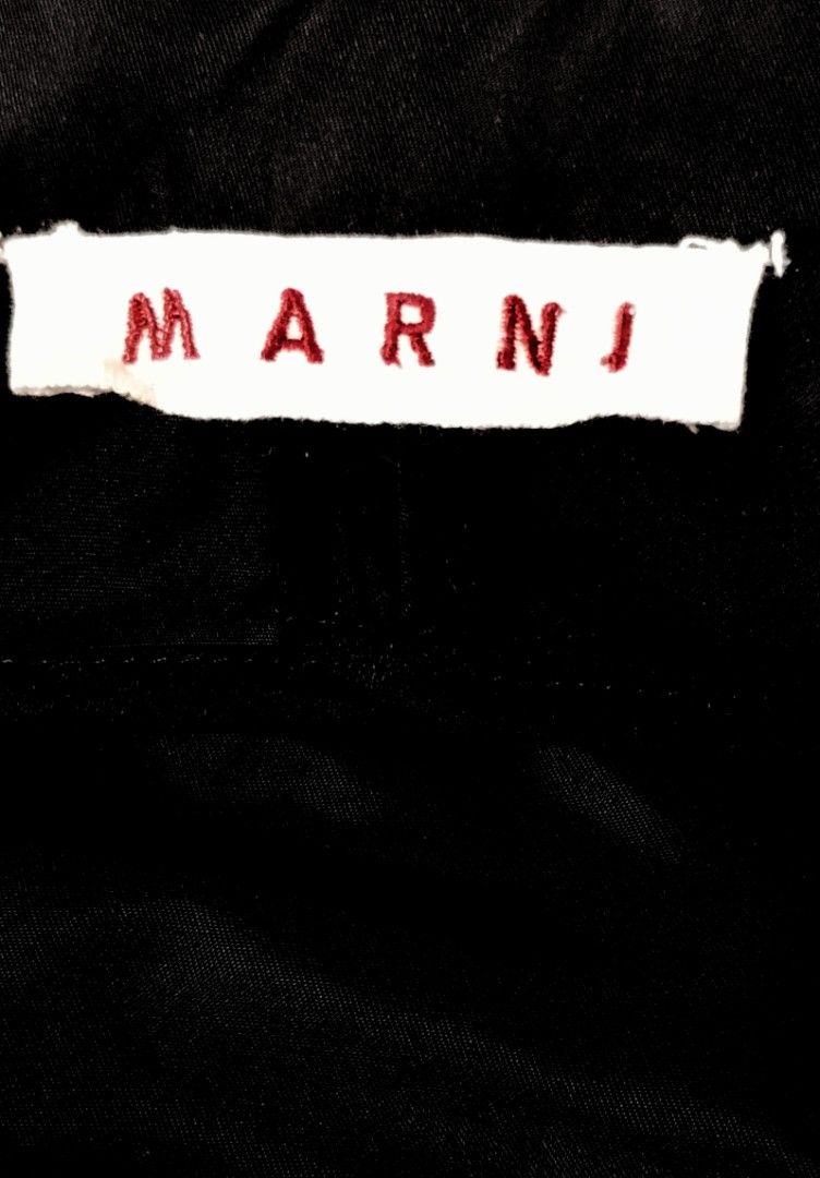 ‼️Sale‼️MARNI black, short-sleeved cropped jacket (Category: Luxury Apparel) located in Cabanatuan. Submitted by miss.maia (Listing ID 1464824302, Image 2). Description: The image displays a black, short-sleeved cropped jacket designed by the luxury fashion house Marni. Armpit to armpit 16" Lenght 20" Shoulder 17 ".