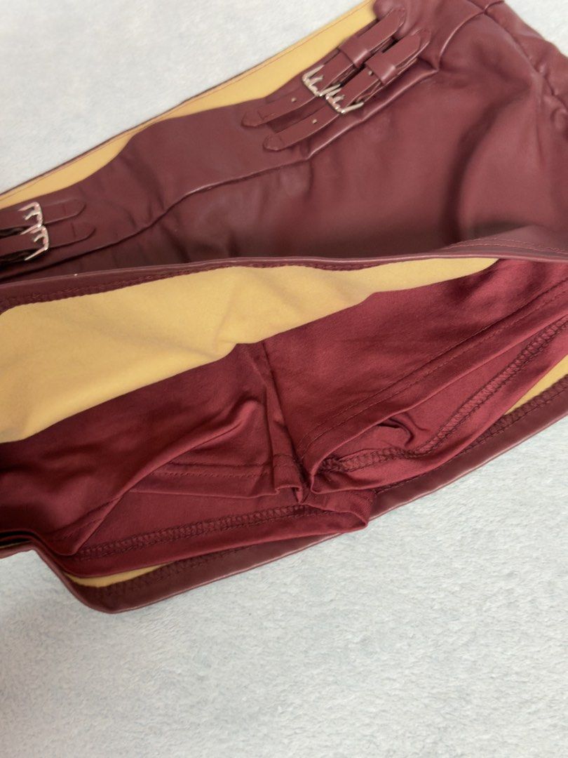 Maroon faux leather buckle skort (Category: Skirts) located in Antipolo. Submitted by hiekeyana (Listing ID 1464786670, Image 2). Description: Maroon mini skirt with shorts .