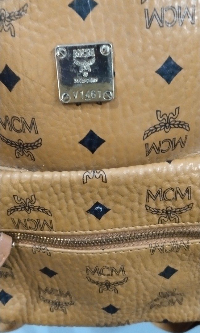 MCM stark vosetos back pack (Category: Luxury Bags & Wallets) located in Trece Martires City. Submitted by vherma (Listing ID 1464773744, Image 3). Description: This appears to be an MCM Stark Visetos Backpack in cognac. Brand & Style: MCM signature coated canvas monogram design in the classic cognac colorway. Features: Front zip pocket, top carry handle, and adjustable shoulder straps with gold-tone hardware. Pricing: Authentic versions typicall