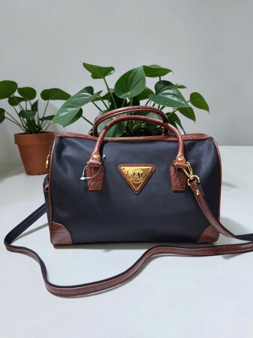MEMORY COLLECTION 2WAY NYLON BOSTON BAG (Category: Cross-body Bags) located in Las Pinas. Submitted by annachiaonair2037 (Listing ID 1464883830, Image 1). Description: MEMORY COLLECTION NYLON 2WAY BOSTON BAG FROM JAPAN NYLON WITH GENUINE CROC LEATHER TRIM MADE IN INDONESIA YKK ZIP DETACHABLE STRAP H 8" L 11.5" W 5.5" Disclaimer: I am not affiliated with, associated with, or authorized by any of the brands featured posted. Any mention of brand nam