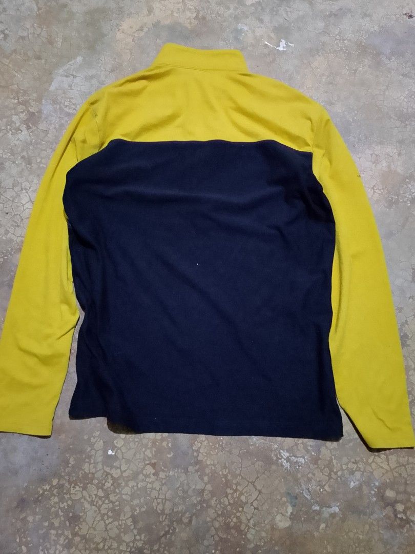 Merrell Long Sleeve Button Neck Pullover Yellow Navy Size L (Category: Coats, Jackets and Outerwear) located in Mandaue City. Submitted by thriftsyap (Listing ID 1464897564, Image 2). Description: - Brand: Merrell - Style: Long sleeve color block pullover shirt - Colors: Mustard yellow and dark navy blue - Features: High collar with button placket, patterned geometric chest band, embroidered branding on chest and sleeve, and small green 'M-Wick' 