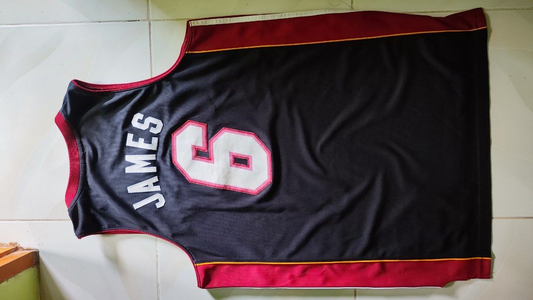 MIAMI HEAT X ADDIDAS LEBRON #6 (Category: Activewear) located in Manila. Submitted by christophermortz_08 (Listing ID 1464799137, Image 3). Description: - LeBron James Miami Heat jersey - Color: Black, red, and yellow - Number 6 on front and back, James on upper back - Adidas branding on chest with jock tag at hem - Size: Medium (Length +2 inches) - Material: 100% polyester - Made in Guatemala.