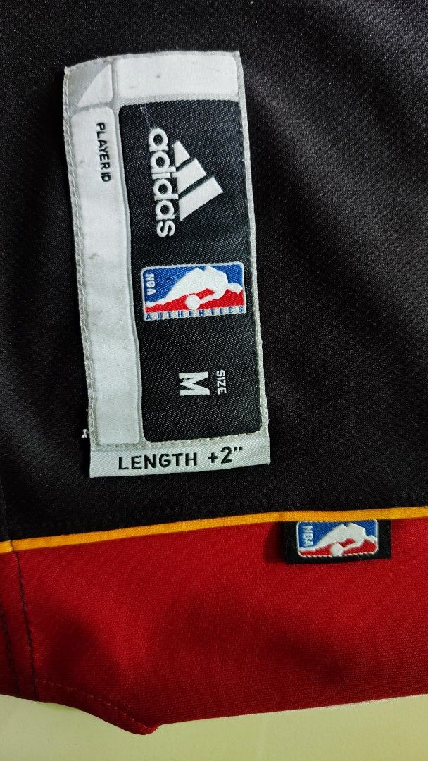 MIAMI HEAT X ADDIDAS LEBRON #6 (Category: Activewear) located in Manila. Submitted by christophermortz_08 (Listing ID 1464799137, Image 2). Description: - LeBron James Miami Heat jersey - Color: Black, red, and yellow - Number 6 on front and back, James on upper back - Adidas branding on chest with jock tag at hem - Size: Medium (Length +2 inches) - Material: 100% polyester - Made in Guatemala.