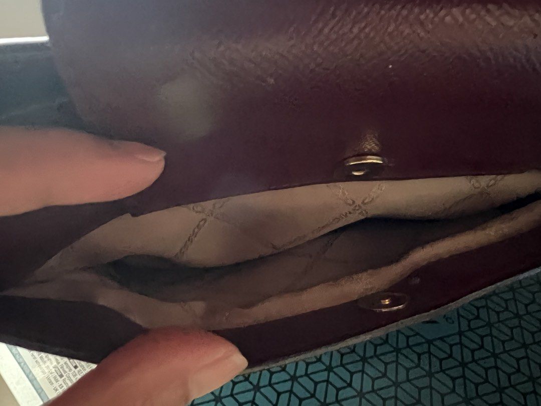 Michael Kors Burgundy Clutch (Category: Clutches) located in Baguio. Submitted by destashglam (Listing ID 1464786449, Image 3). Description: - Authentic Michael Kors crossbody bag in rich burgundy leather - Elegant gold-tone MK logo hardware with a magnetic snap front flap - Signature logo-print interior lining - Well-organized layout featuring multiple compartments, card slots, and a zippered middle section - 6 cards slot -lost strap but perfect