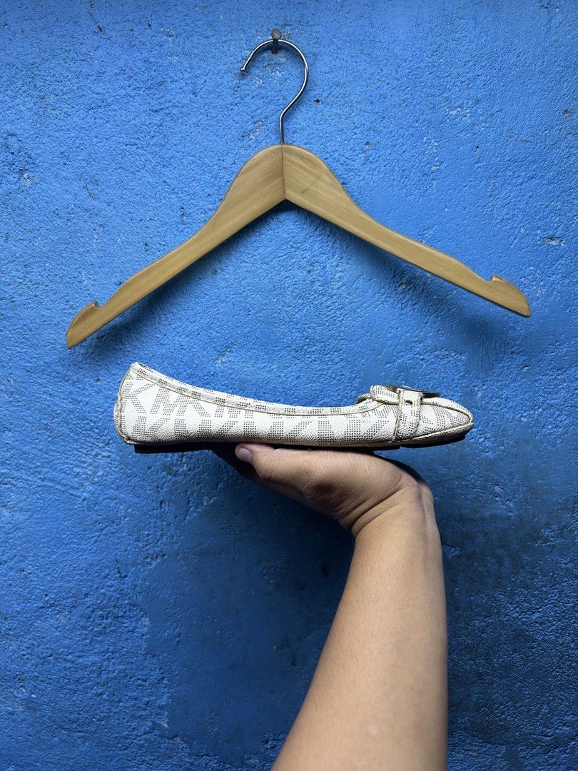 Michael Kors Logo Print Flats (Category: Flats & Sandals) located in Quezon City. Submitted by thriftxgoods (Listing ID 1464897683, Image 3). Description: - Brand: Michael Kors - Color: Beige with all-over signature MK monogram - Design: Round toe, slip-on style for easy everyday wear - Details: Gold-tone MK logo hardware buckle strap and metallic gold inner lining - Comfort: Fitted with rubber pod soles for extra grip.