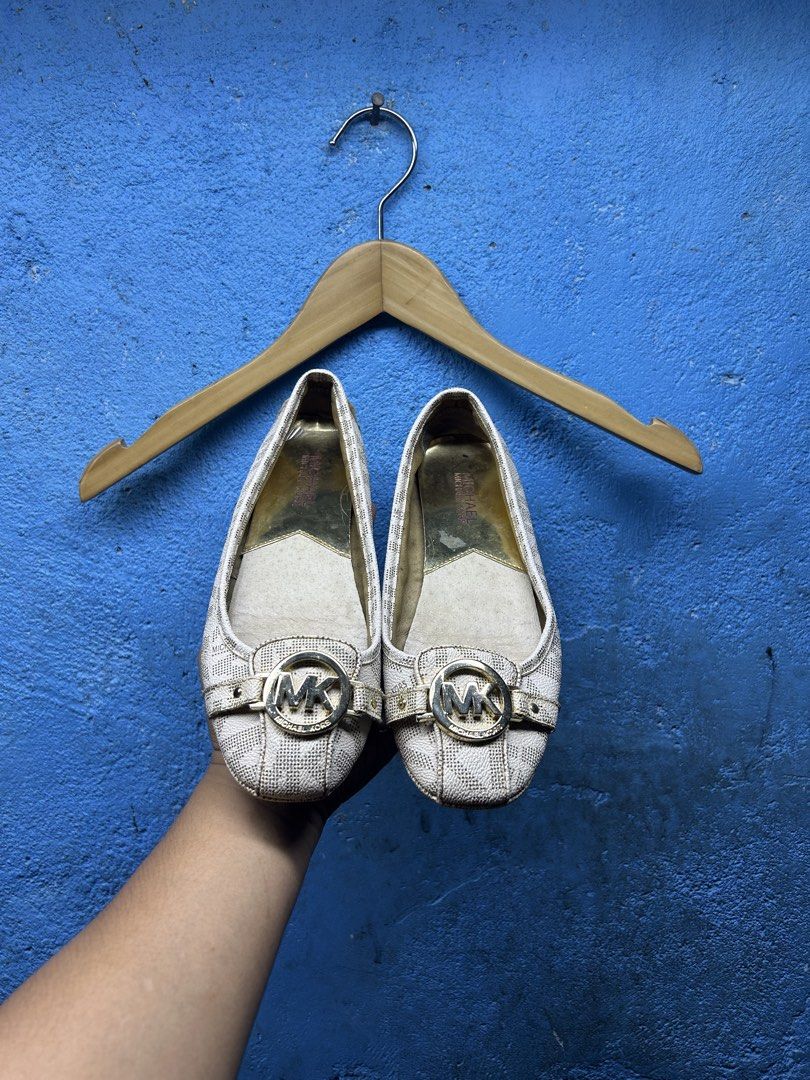 Michael Kors Logo Print Flats (Category: Flats & Sandals) located in Quezon City. Submitted by thriftxgoods (Listing ID 1464897683, Image 1). Description: - Brand: Michael Kors - Color: Beige with all-over signature MK monogram - Design: Round toe, slip-on style for easy everyday wear - Details: Gold-tone MK logo hardware buckle strap and metallic gold inner lining - Comfort: Fitted with rubber pod soles for extra grip.
