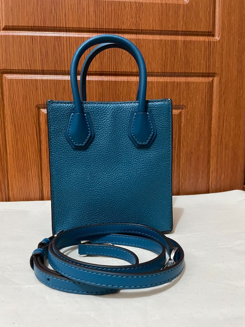 Michael Kors Mercer Shopper Bag XS (Category: Cross-body Bags) located in Quezon City. Submitted by beckyshop2024 (Listing ID 1464933332, Image 2). Description: - Used once - In mint condition - Original from US - Top handle with detachable strap - Color: Lagoon.