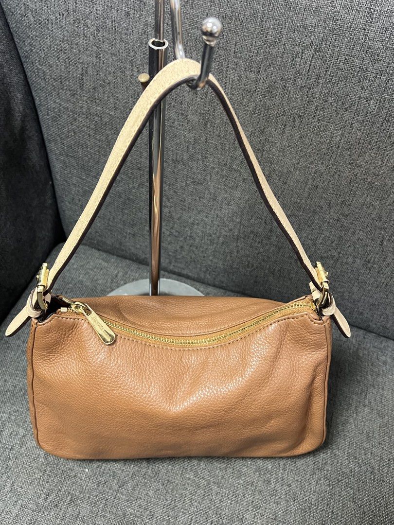 Michael Kors Tan Leather Shoulder Bag (Category: Luxury Bags & Wallets) located in General Trias. Submitted by mybag2025 (Listing ID 1464906502, Image 2). Description: - Brand: Michael Kors - Material: Tan pebbled leather - Hardware: Gold-tone - Strap: Light beige contrast strap - Closure: Top zip closure - Interior: MK logo fabric lining with a zip pocket - Condition: Clean bottom and corners - Size: Great for daily carry.