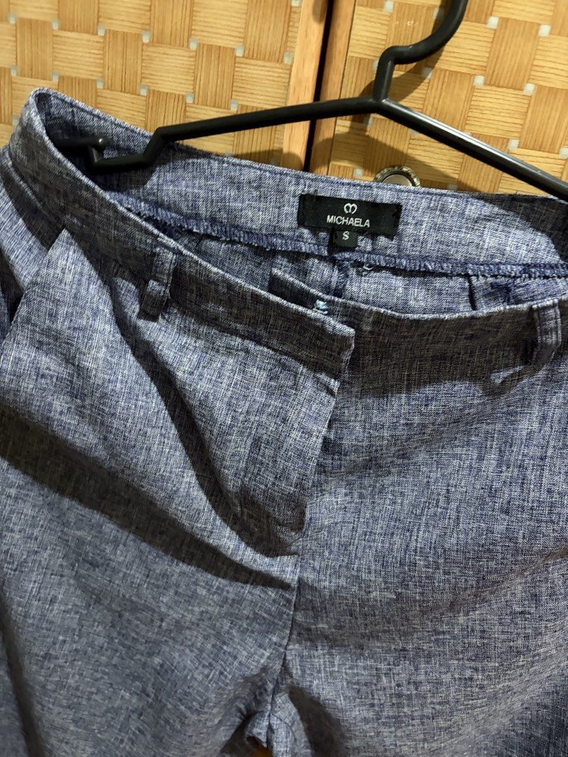 Michaela Blue Marl Casual Trousers Size S (Category: Jeans) located in Pangil. Submitted by chel_anne (Listing ID 1464843701, Image 3). Description: - Brand: Michaela - Size: S (tag attached at waistband) - Color: Blue marl - Details: Textured fabric, straight leg cut, folded cuffs at hem - Features: Front pockets, belt loops, zip fly with button closure - Condition: Clean, brand new with tags.
