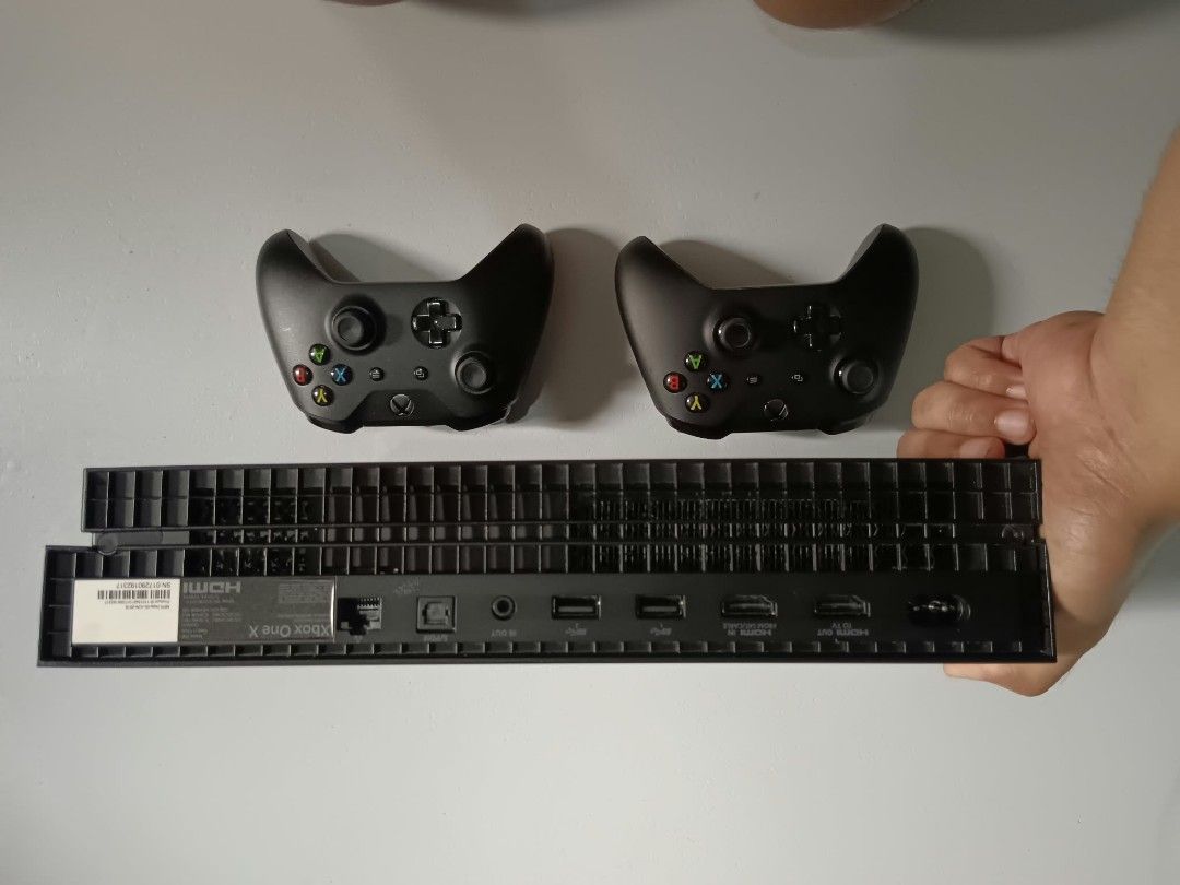 Microsoft Xbox One X console with two controllers (Category: Xbox) located in Manila. Submitted by eurussid (Listing ID 1464805405, Image 2). Description: Selling Xbox One X 1TB with 2 controllers Hindi naka jailbreak. Games - Red Dead Redemption 2 Ultimate edition - Nba 2k26 - Tekken 7 - Elden ring. .