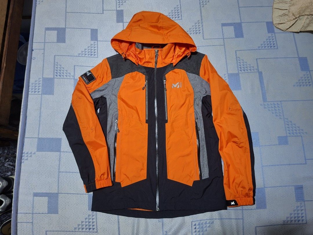 Millet Hardshell Outdoor Jacket (Category: Coats, Jackets and Outerwear) located in Agdangan. Submitted by jrmygrrr (Listing ID 1464885186, Image 1). Description: Dimes: 21x27 Color: Orange/Black/Grey Hardshell Good as new No issues .