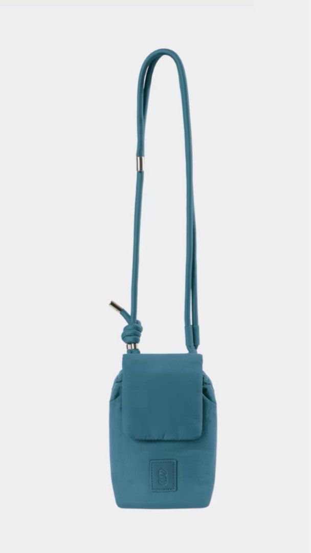 Mini Crossbody Phone Bag (Category: Cross-body Bags) located in Cavite. Submitted by nikkatsu (Listing ID 1464841596, Image 3). Description: - Trendy mini crossbody bag designed for hands-free convenience - Features a secure flap pocket, drawstring closure, and stylish knotted rope strap - Compact size perfect for carrying daily essentials - Accented with a chic debossed logo patch on the front - Available in 4 vibrant colors: Orange, Olive Green