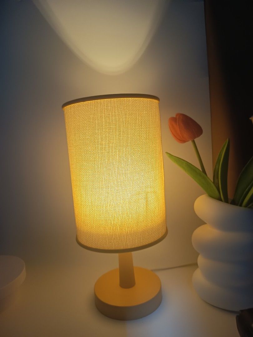 Minimalist beige bedside table lamp with cylindrical fabric shade (Category: Lighting) located in Manila. Submitted by heyjka_19xx (Listing ID 1464879335, Image 1). Description: - Color: Warm beige - Shade: Cylindrical woven fabric for soft yellow light - Base: Solid round matching neutral tone - Power: USB cord with convenient inline switch - Size: Compact, ideal for small bedside tables and desks - Vibe: Creates cozy ambient lighting for bedroo
