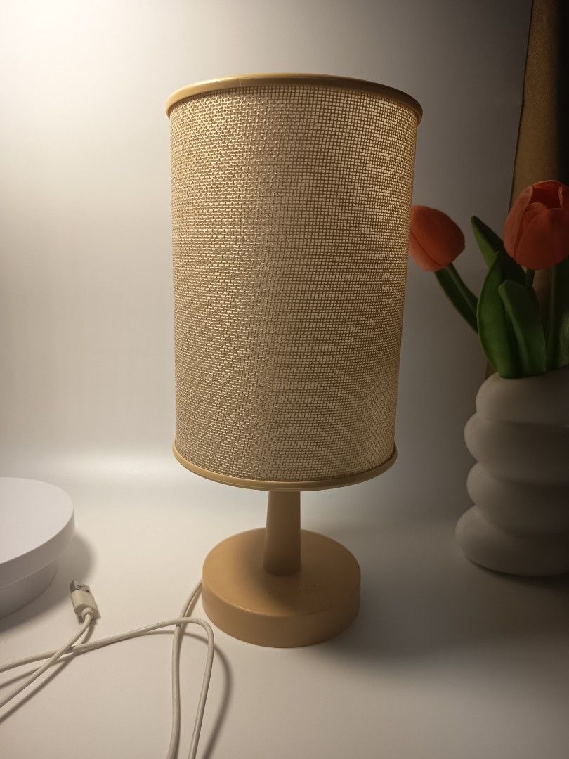 Minimalist beige bedside table lamp with cylindrical fabric shade (Category: Lighting) located in Manila. Submitted by heyjka_19xx (Listing ID 1464879335, Image 3). Description: - Color: Warm beige - Shade: Cylindrical woven fabric for soft yellow light - Base: Solid round matching neutral tone - Power: USB cord with convenient inline switch - Size: Compact, ideal for small bedside tables and desks - Vibe: Creates cozy ambient lighting for bedroo