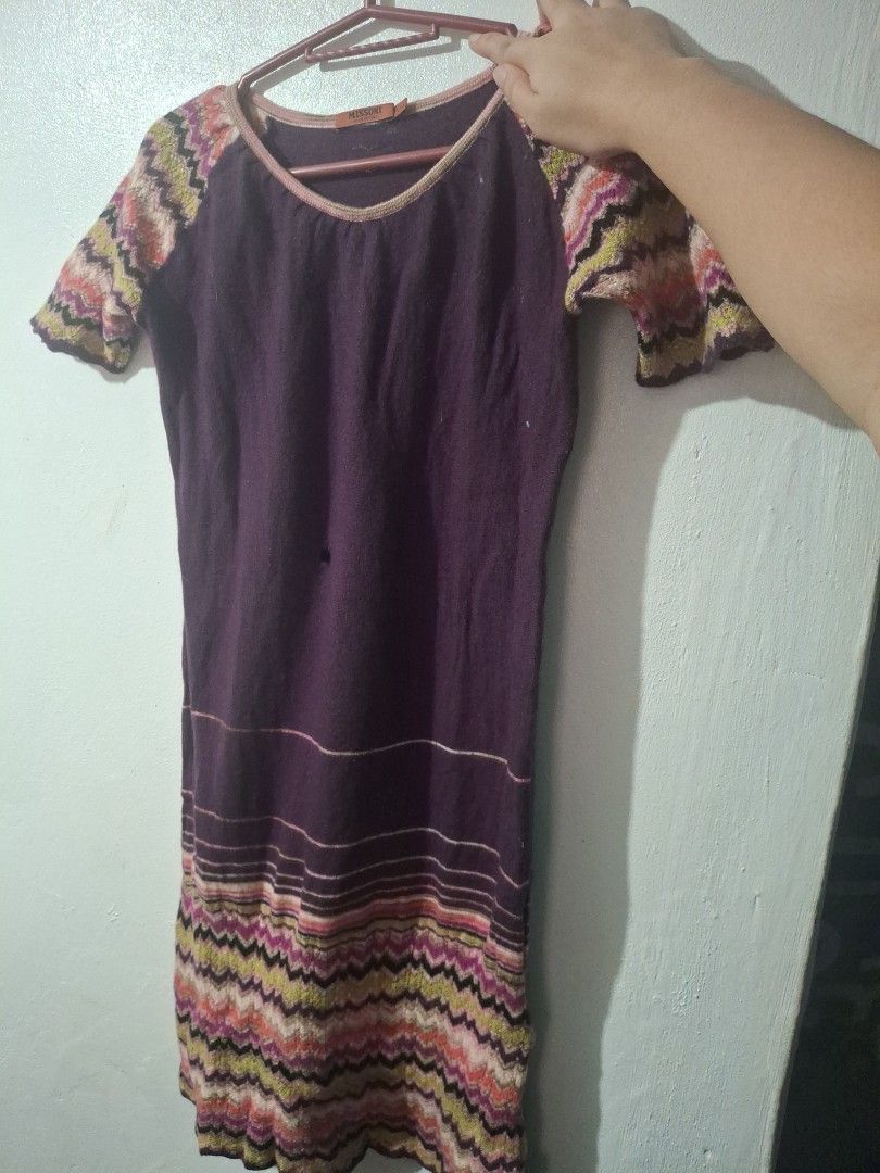 Missoni Knit Dress Purple Zigzag Pattern Size M (Category: Dresses) located in Quezon City. Submitted by 042361 (Listing ID 1464802273, Image 2). Description: - Will be given free if you buy minimum of 3 - Has a hole in the middle - Brand: Missoni - Color: Dark purple with multicolored zigzag chevron details - Design: Round neckline with pink trim, short sleeves, branded interior tag - Fit & Fabric: Soft, stretchy knit fabric with a beautiful dra