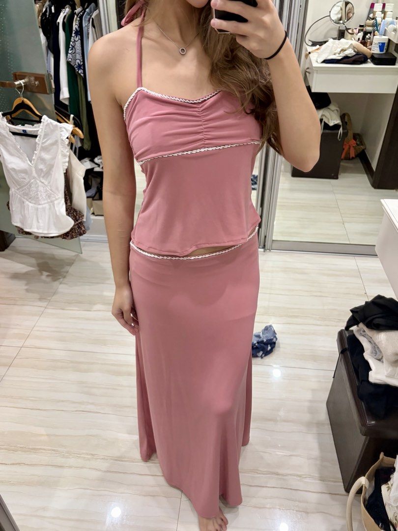 Miu The Label Pink Vera Set (Category: Sets or Coordinates) located in Pasig City. Submitted by luxurypreloved12 (Listing ID 1464900341, Image 2). Description: Miu The Label - Top is size S while the skirt is M. I am usually an XS now and lost some weight so this is what it looks like on me. Its p stretchy and loose on me. Selling as set only! RFS: I have 2 others with the same design diff colors :)) - Color: Dusty pink with white beaded trim det