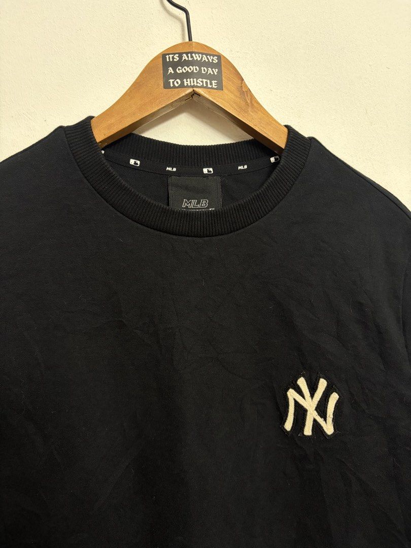 MLB New York Yankees Black Sweatshirt (Category: Coats, Jackets and Outerwear) located in Bulacan. Submitted by chrlzchrstnfntn33 (Listing ID 1464865499, Image 3). Description: - Brand: MLB New York Yankees - Item: Sweatshirt / Pullover - Color: Black with white embroidered NY logo - Size: S (Tagged) - Material: Cotton and polyester blend - Details: MLB logo patch on back collar, ribbed cuffs, collar, and hem - Condition: Excellent / Pre-loved (r