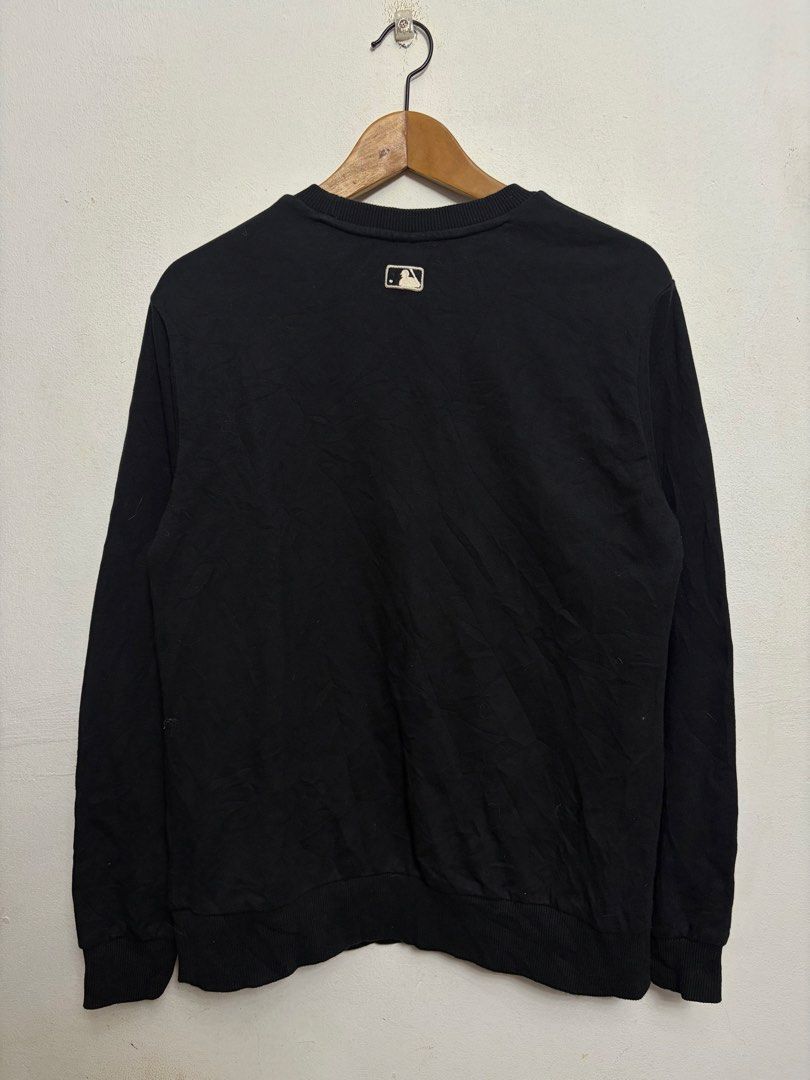 MLB New York Yankees Black Sweatshirt (Category: Coats, Jackets and Outerwear) located in Bulacan. Submitted by chrlzchrstnfntn33 (Listing ID 1464865499, Image 2). Description: - Brand: MLB New York Yankees - Item: Sweatshirt / Pullover - Color: Black with white embroidered NY logo - Size: S (Tagged) - Material: Cotton and polyester blend - Details: MLB logo patch on back collar, ribbed cuffs, collar, and hem - Condition: Excellent / Pre-loved (r