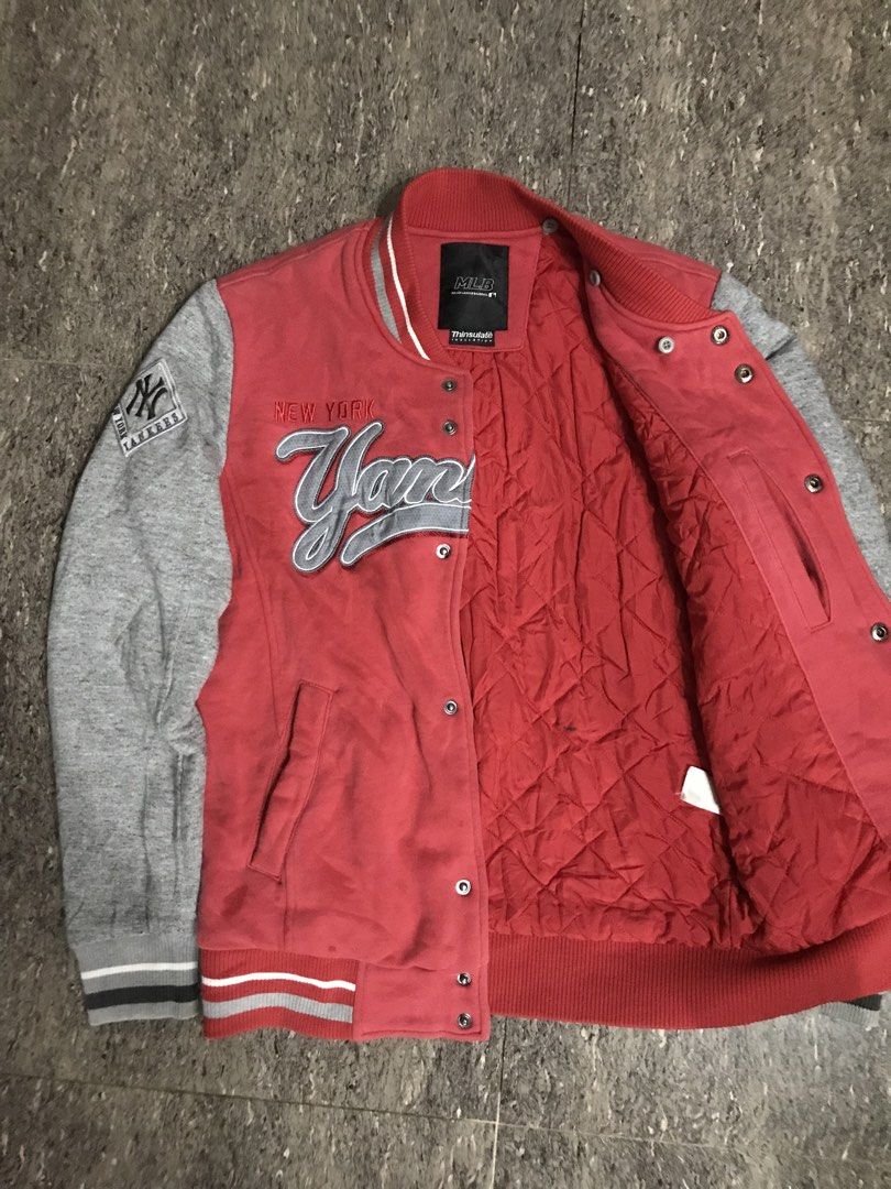MLB New York Yankees Varsity Jacket Red Grey (Category: Coats, Jackets and Outerwear) located in Sominot (Don Mariano Marcos). Submitted by bibi_francis (Listing ID 1464914561, Image 2). Description: - Authentic MLB New York Yankees merchandise - Eye-catching red body with contrasting grey sleeves - Warm quilted inner lining with Thinsulate insulation - Classic snap button front closure - Premium embroidered Yankees chest lettering and right slee