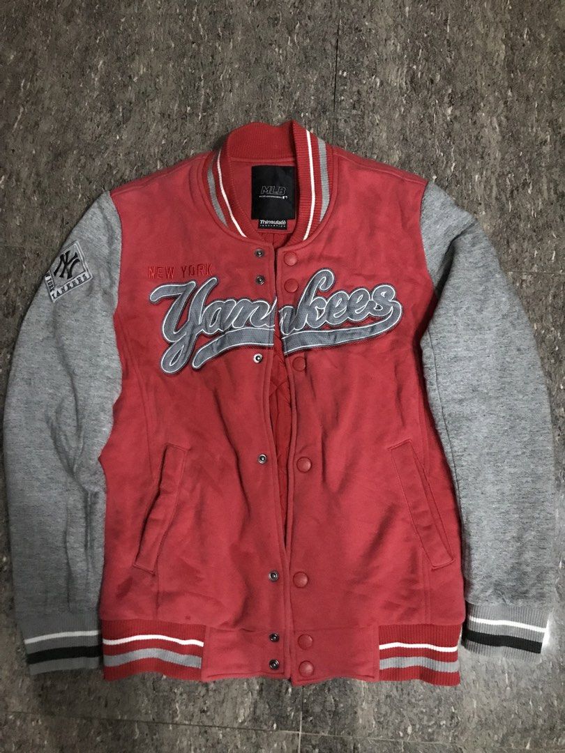 MLB New York Yankees Varsity Jacket Red Grey (Category: Coats, Jackets and Outerwear) located in Sominot (Don Mariano Marcos). Submitted by bibi_francis (Listing ID 1464914561, Image 1). Description: - Authentic MLB New York Yankees merchandise - Eye-catching red body with contrasting grey sleeves - Warm quilted inner lining with Thinsulate insulation - Classic snap button front closure - Premium embroidered Yankees chest lettering and right slee