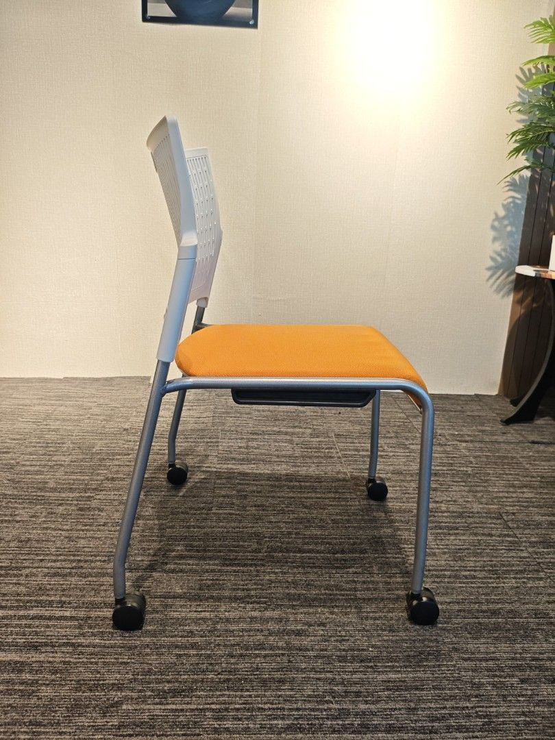 Modern Orange and White Office Chair with Wheels (Category: Office Furniture & Fixtures) located in Quezon City. Submitted by kevinmacabata12997160 (Listing ID 1464772549, Image 3). Description: - Vibrant bright orange fabric seat cushion for a pop of color - Breathable white plastic backrest - Grey KOKUYO office chair - Comfortable and ergonomic design - Swivels and has wheels for easy movement - Ideal for home office or study - Sturdy build you