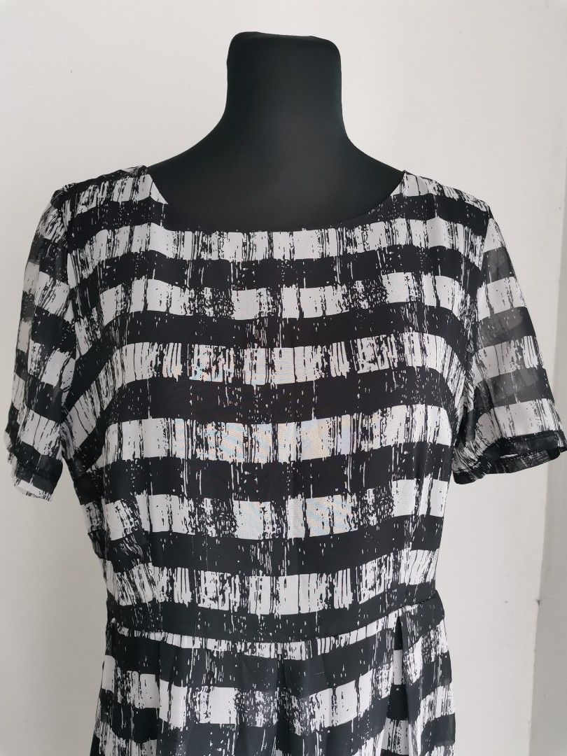 Monochrome Horizontal Stripe Dress (Large) (Category: Dresses) located in Quezon City. Submitted by engeleaize (Listing ID 1464834277, Image 3). Description: Details: Color: Black and Off-White Style: Lightweight silhouette dress, scoop neckline, sheer short sleeves, distressed brushstroke patterns, side zipper, with inner lining Fabric: Chiffon Polyester Best worn: Smart casual wear, church services Bust: 38 inches Waist: 34 inches Length: 38 in