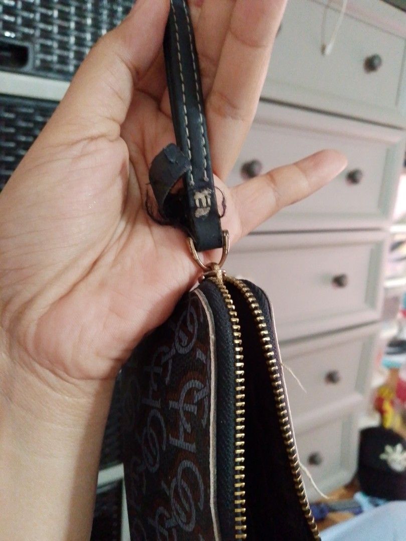 Monogram Pattern Zip Pouch Wallet (Category: Luxury Bags & Wallets) located in Manila. Submitted by russelsimo37305 (Listing ID 1464793686, Image 2). Description: - Stylish dark brown and light blue monogram design - Secure zipper closure for coins and cards - Convenient side wrist strap included - Compact size fits easily in larger bags or pockets - Clean and premium material texture.